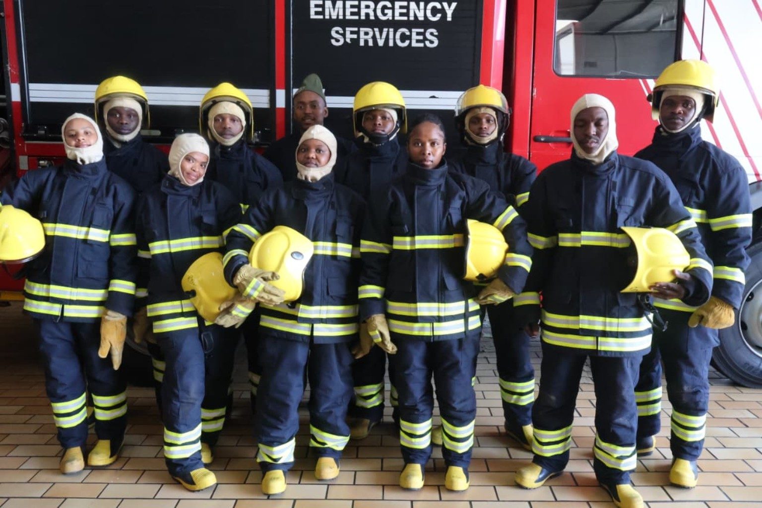Students in PPE at fire engine